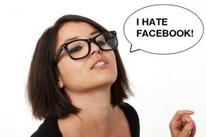 Girl in Glasses with Thought Bubble that Reads: "I Hate Facebook!"