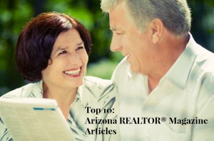 Happy smiling attractive elderly couple reading together outdoors